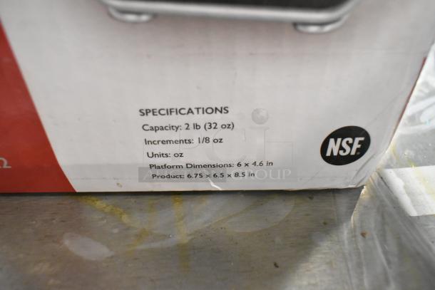 San Jamar Escali Pro MZR SCMDL2 kitchen scale, 2 lb capacity, new scratch and dent condition. NSF certified.