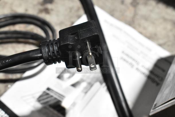 Close-up of electrical plug for Avantco 184T3600D commercial conveyor toaster, showing a standard prong plug.