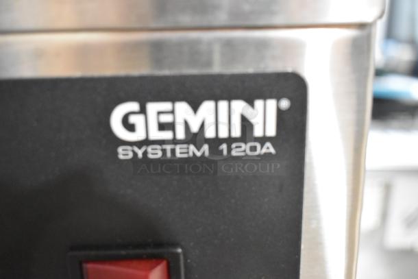 Brand new Curtis GEM-120A-10 coffee brewer with minor scratches and dents. Stainless steel, 120V, 1 phase. Gemini branding visible.
