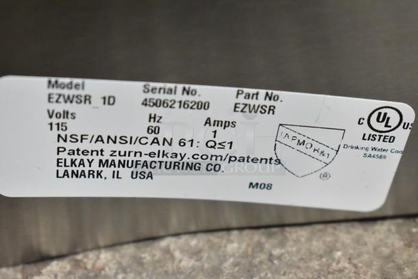 Elkay EZWSR_1D Water Bottle Filler label showing model, serial number, 115 volts, 60 Hz. New with scratch and dent.