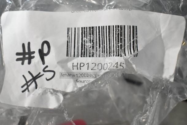 Label showing Amana 12002453 Kit, Handle W/Screws HP12002453 in packaging. Barcode and handwritten marks visible.