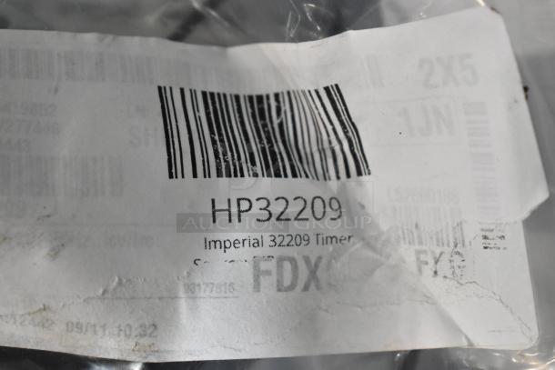Imperial 32209 Timer with barcode and label showing model HP32209. New condition, slight packaging wear visible.
