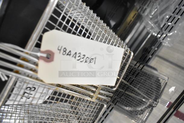 Chrome fryer basket, tag marked "48AA33001", brand new, part of 7-item scratch and dent auction. Perfect for commercial use.
