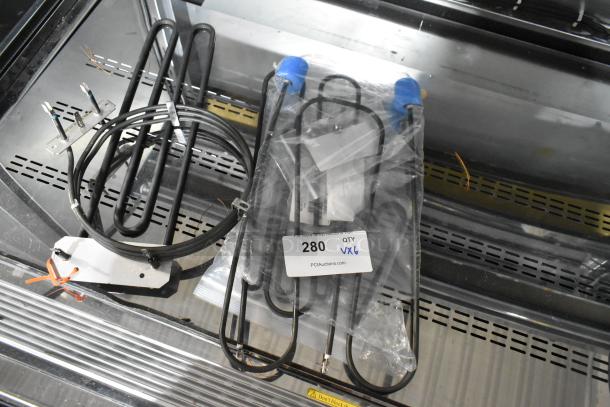 6 new Hatco heating elements, models R02.08.581.03, 02.05.998.00, and 02.09.304.00, 208V. Quantity 6, tagged.