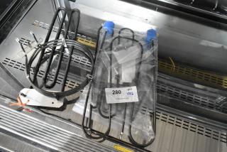 6 new Hatco heating elements, models R02.08.581.03, 02.05.998.00, and 02.09.304.00, 208V. Quantity 6, tagged.