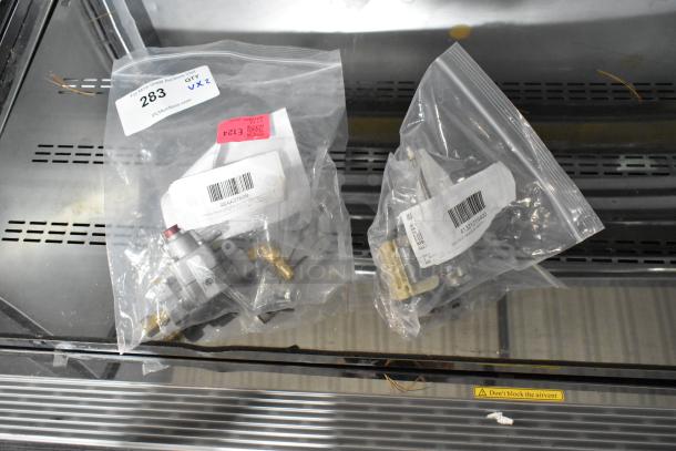 Brand new American Range A37608 safety valve assembly and Hatco 02.12.154.00 motor in sealed bags with labels.