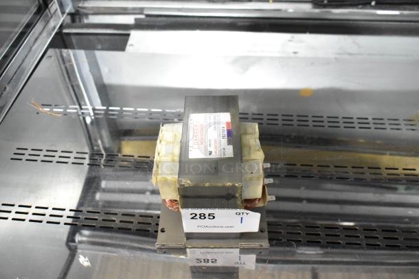 Industrial capacitor with "Danger High Voltage" label, model PPE581823C, in good condition. Auction tag 285 visible.