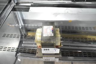 Industrial capacitor with "Danger High Voltage" label, model PPE581823C, in good condition. Auction tag 285 visible.