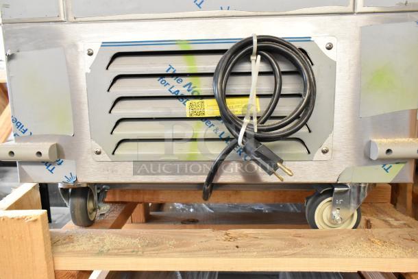 Brand new 2022 H&K 52473-1 stainless steel commercial French fry freezer with fry basket holder, on casters, 115V, 1 phase.