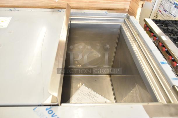 Stainless steel commercial french fry freezer, H&K 52473-1, new in crate, with fry basket holder, on commercial casters.