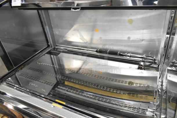 Avantco 193HAC51B black horizontal air curtain merchandiser, 47", with LED lighting, 1 shelf. 115V, 1 phase. Good condition.