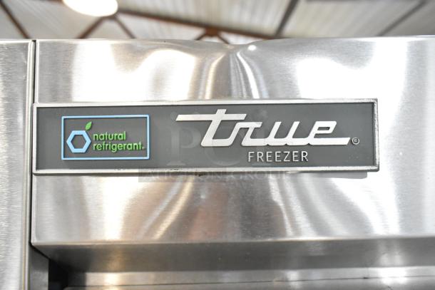 2020 True T-19F-HC stainless steel commercial freezer, single door, natural refrigerant label, poly-coated racks.