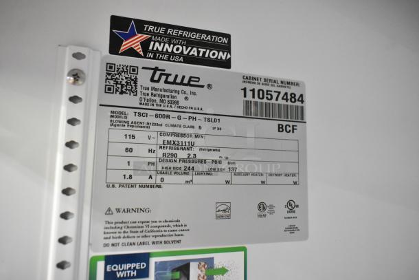 "Label on a True TSCI-600R-G-PH cooler, showing specifications like 115 volts, R290 refrigerant, and model details."