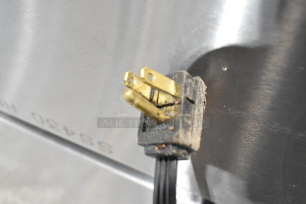 2025 Whirlpool WRT311FZDM05, stainless steel. Visible plug detail, slight scratches on surface. 115V, 1 phase.
