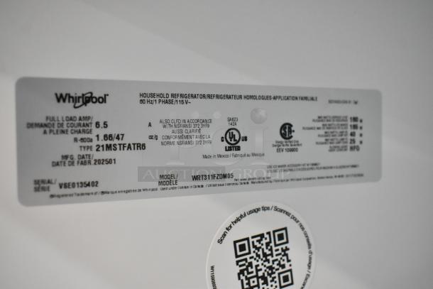 Label on a Whirlpool WRT311FZDM05 stainless steel refrigerator, showing model, serial number, and electrical specifications.