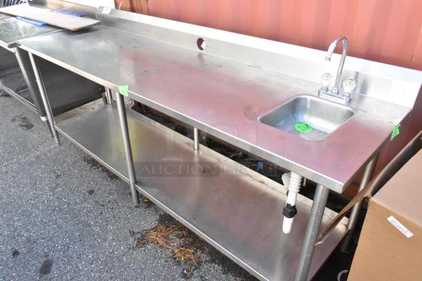 Stainless steel table with sink bay, back splash, under shelf, and faucet. Good condition, ideal for commercial kitchens.