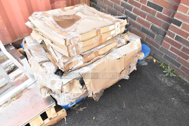 Pallet with 5 Lancaster Table & Seating Metal Table Base Feet in damaged boxes, labeled "FR Feel."