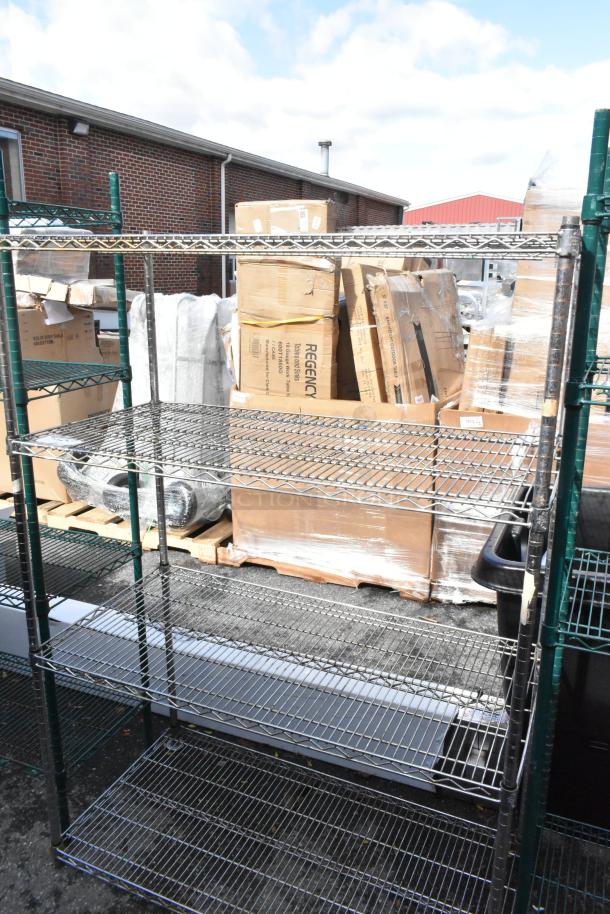 Chrome finish 4-tier wire shelving unit outdoors, good condition. Buyer must dismantle for shipping. Freight charges apply.