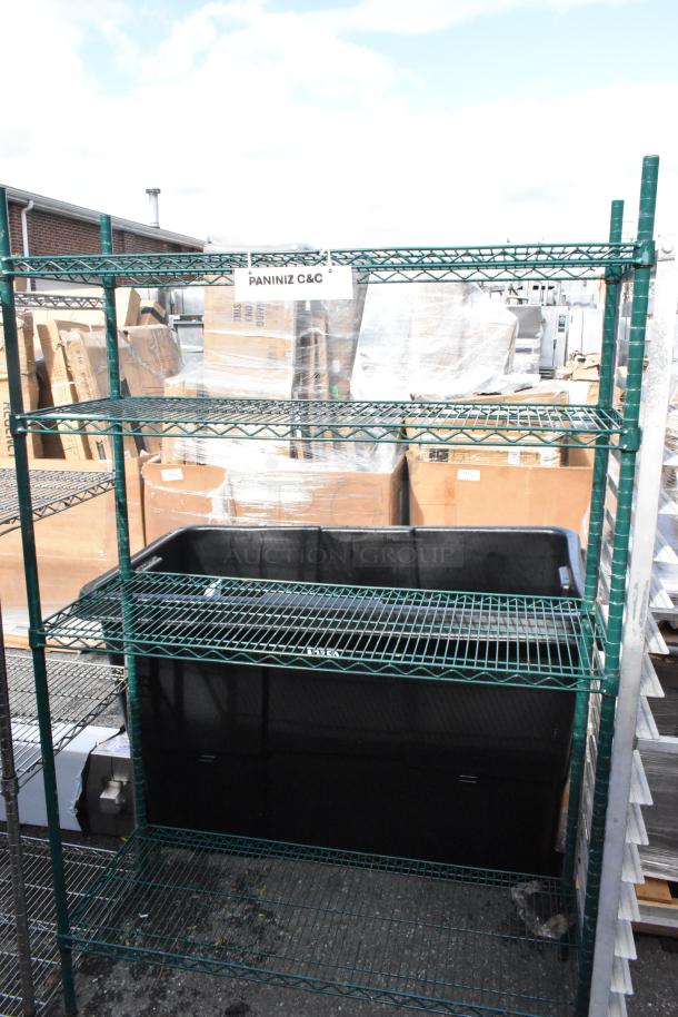 Green finish 4-tier wire shelving unit in used condition. Label reads "PANINIZ C&C." Buyer must dismantle for shipping.