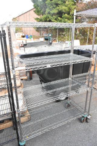 Chrome finish 4-tier wire shelving unit on commercial casters, requires buyer dismantling, consider freight.