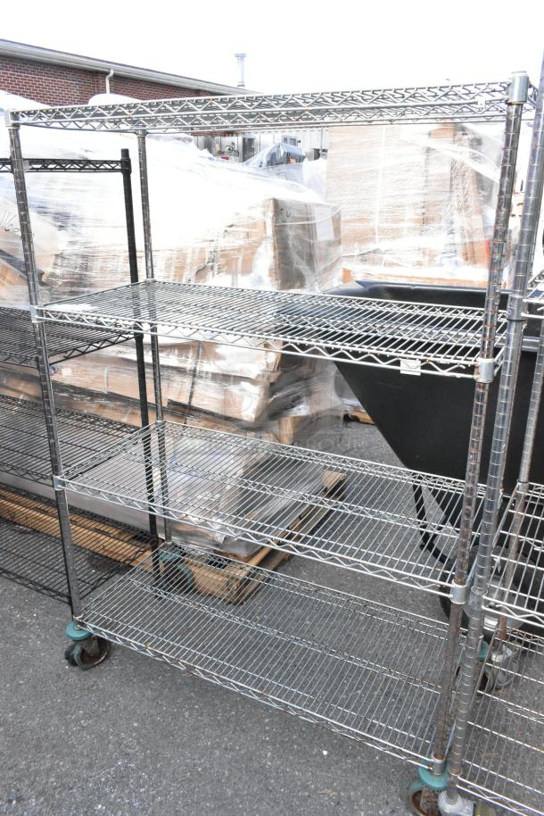 Chrome finish 4-tier wire shelving unit on commercial casters; sturdy, spacious, ideal for storage, requires dismantling.