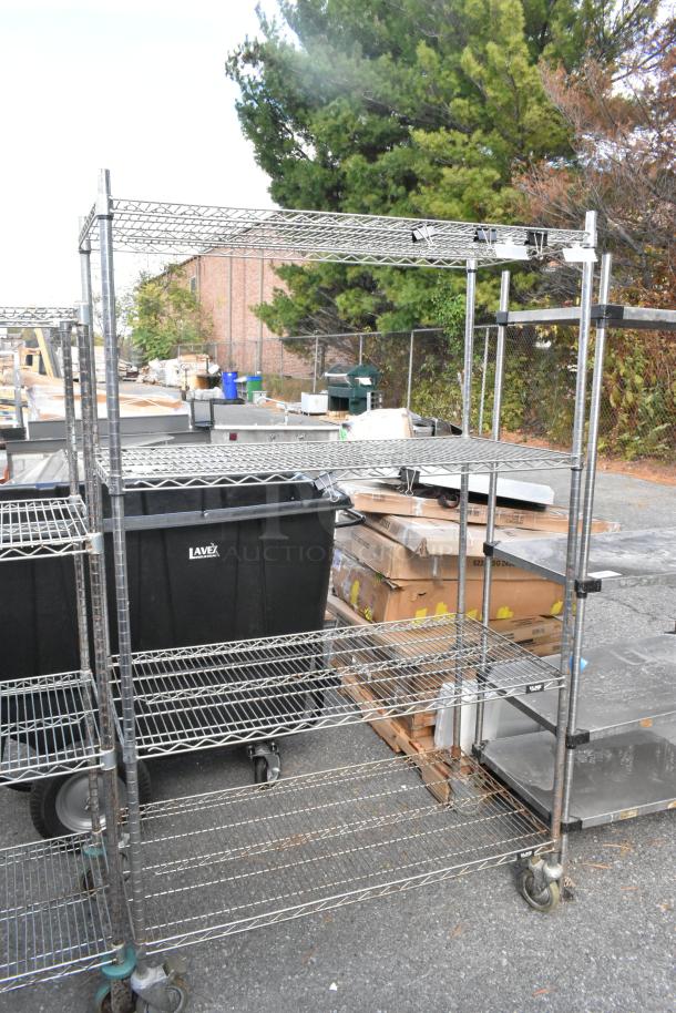 Chrome finish 4 tier wire shelving unit on commercial casters, outdoor setting. Buyer must dismantle for pickup.