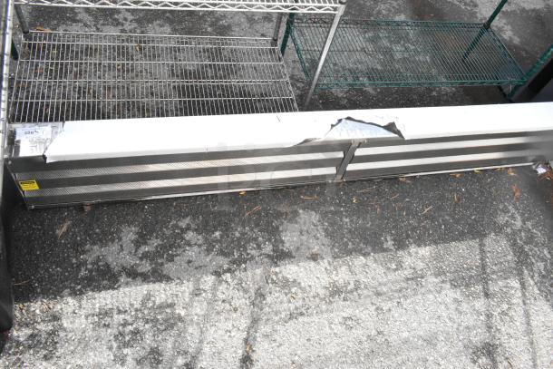BRAND NEW SCRATCH AND DENT metal unit with visible dents and scratches. Metal construction, rectangular shape, label indicates slight damage.