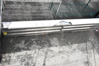 BRAND NEW SCRATCH AND DENT metal unit with visible dents and scratches. Metal construction, rectangular shape, label indicates slight damage.