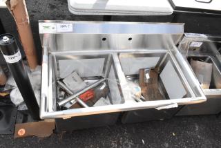Brand new Regency 600S21818 sink, 74" stainless steel, two compartments, 18" x 18" x 14" bowls, galvanized legs, minor dents.