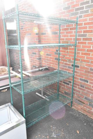 Green 4-tier wire shelving unit, outdoor setting, dismantling required for shipping, freight charges apply.
