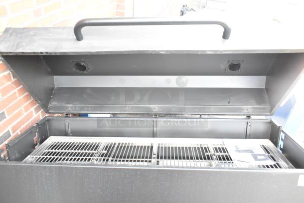 Brand new Backyard Pro 60" charcoal/wood smoker grill, adjustable grates, minor scratches.