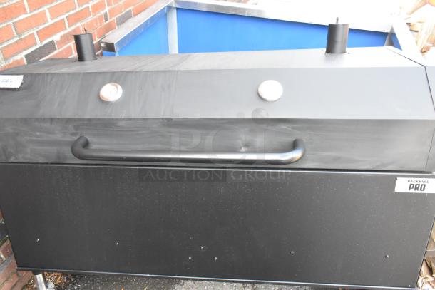 BRAND NEW Backyard Pro 554SMOKR60AS 60" charcoal/wood smoker grill, assembled, with adjustable grates. Minor scratches and dents visible.