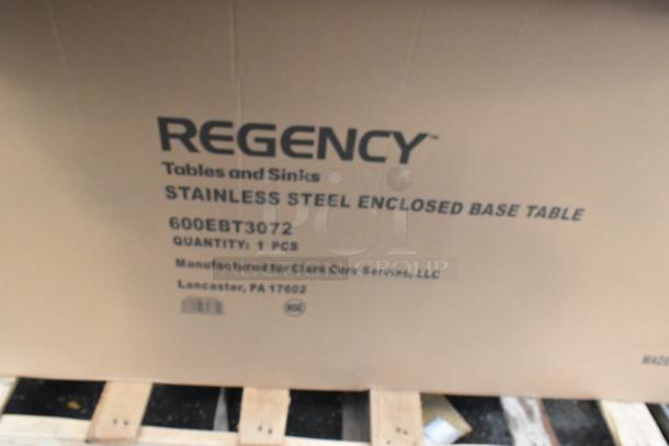 Brown box labeled "Regency Stainless Steel Enclosed Base Table," 600EBT3072 model on a pallet.