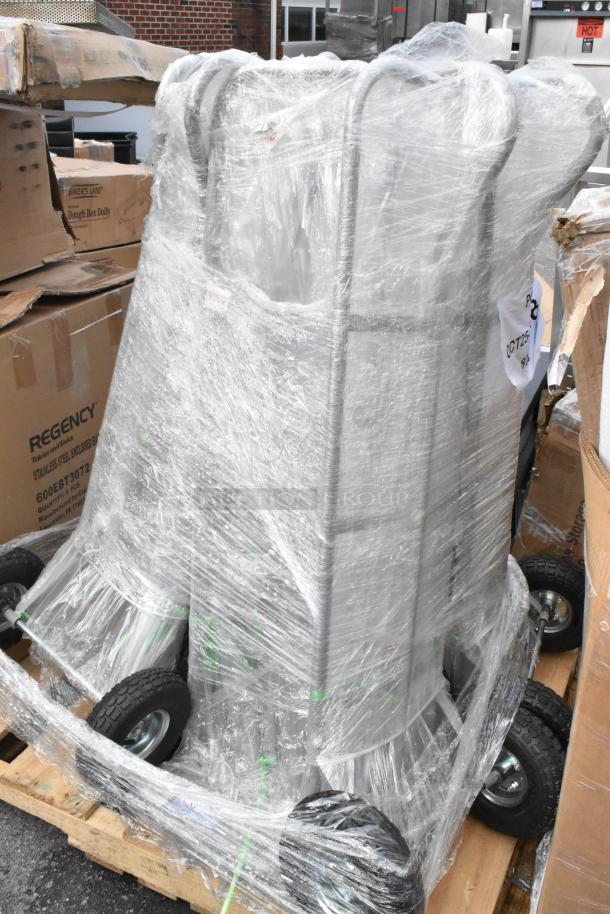 Seven new Lavex 503HDTP600GR gray hand trucks, 600 lb. capacity, 10" pneumatic wheels, wrapped on a pallet, scratch and dent condition.