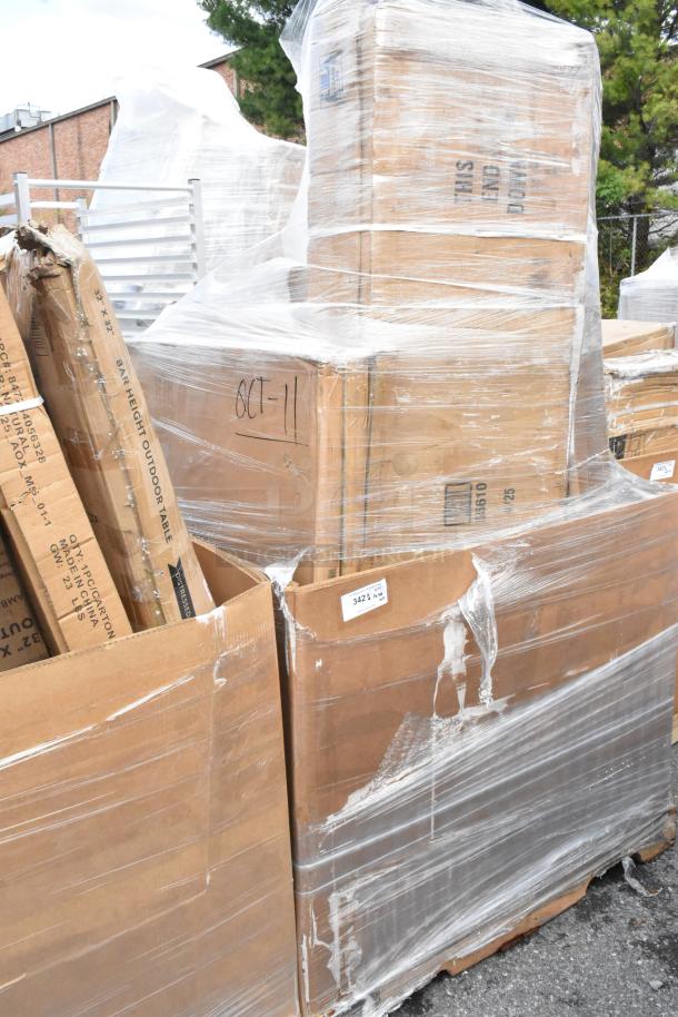 Pallet lot with scratch and dent table tops, equipment stands in cardboard boxes wrapped in plastic. Markings include "OCT-11."