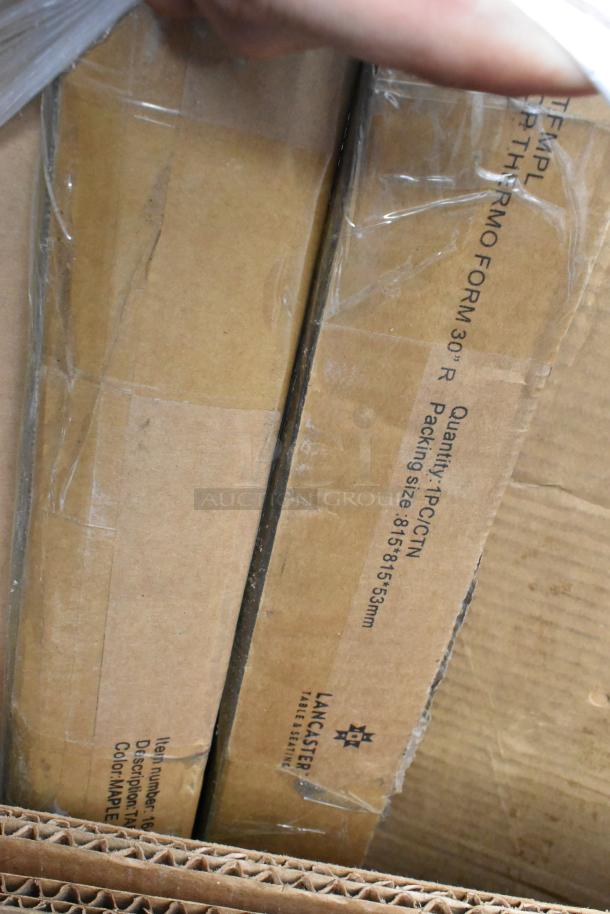 Pallet lot with table tops and equipment stand. Lancaster Table Seating label, packaging size 815x815x53mm, some wear visible.