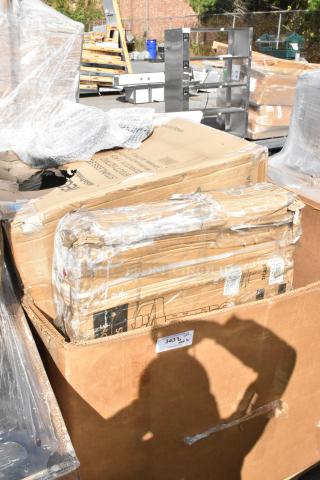 Five brand new scratch and dent items in boxes, including Regency and Lavex utility carts with visible packaging damage.