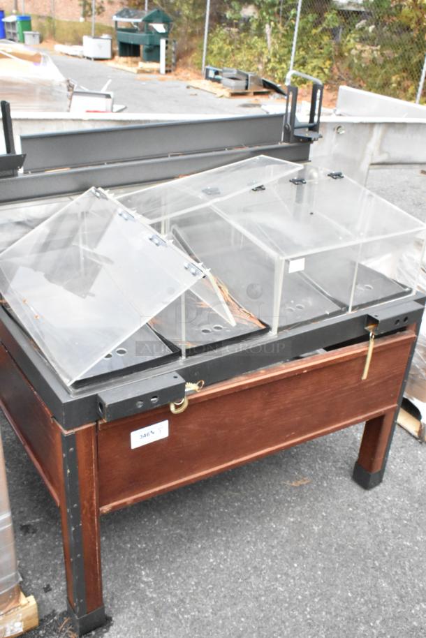 Wooden and metal dry merchandising station with clear plastic bins and hinged lids. Item tag reads "346 T".
