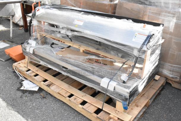 Brand new Alto Shaam commercial heated merchandiser, metal, scratch and dent condition, wrapped on a pallet.