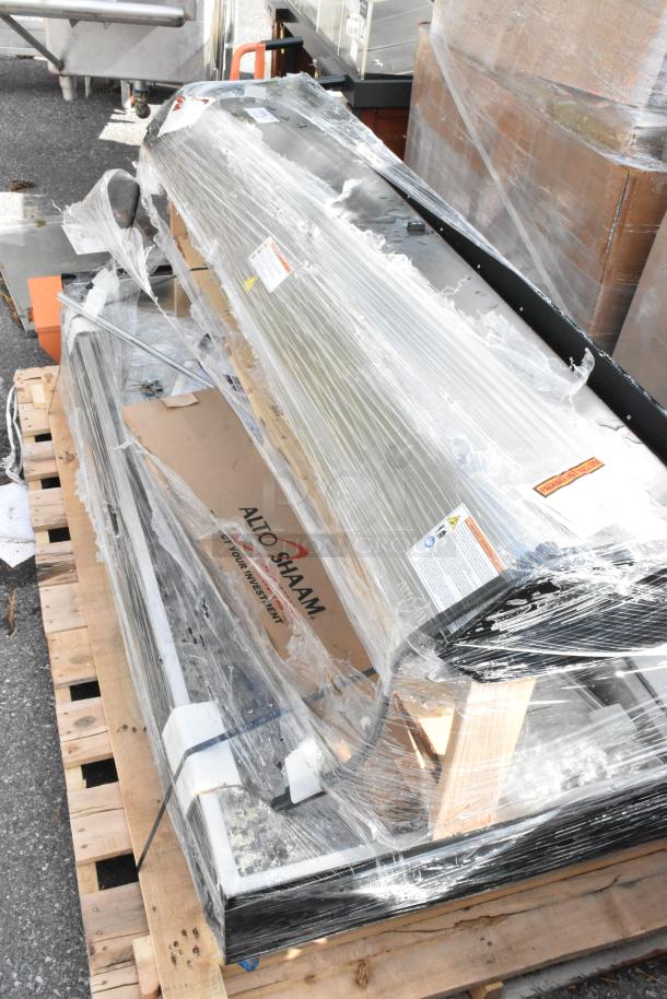 Brand new Alto Shaam metal commercial heated merchandiser, still wrapped, shows minor scratches and dents.