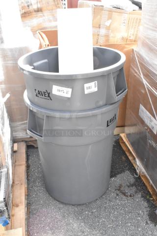 2 new Lavex 475TCRND55GY 55-gallon gray round commercial trash cans. Some scratches/dents. Labels visible.