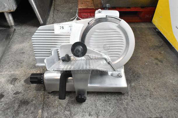 Globe G10 metal commercial meat slicer with blade sharpener, features 115 volts, 1 phase. Slight wear visible.