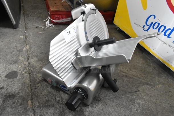 Globe G10 Metal Commercial Meat Slicer with blade sharpener, 115 volts, 1 phase, excellent condition, includes manufacturer label.