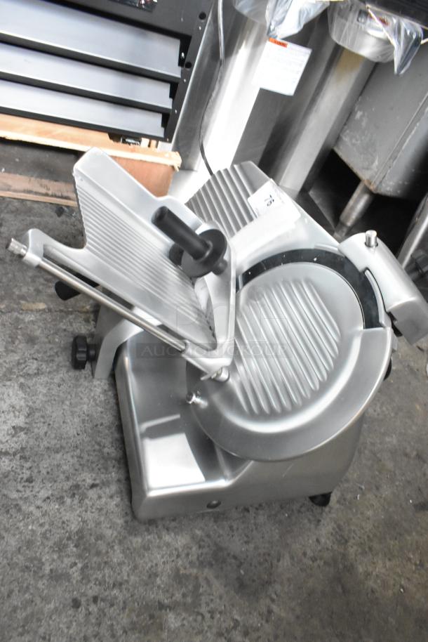 Globe G10 metal commercial countertop meat slicer with blade sharpener, 115 volts, 1 phase, in good condition.