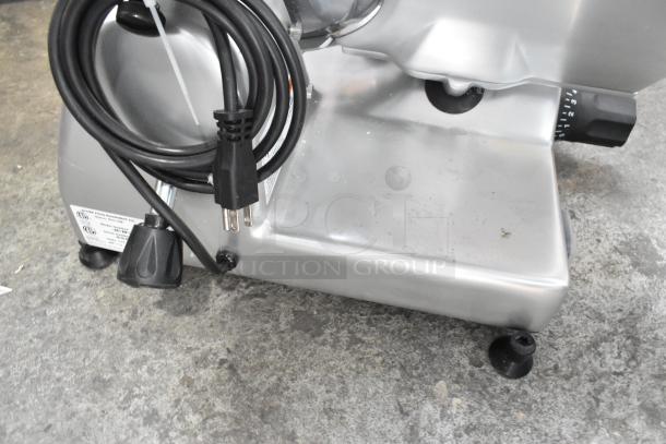 Globe G10 commercial countertop meat slicer with blade sharpener, 115V. Features metal construction, visible power cord.