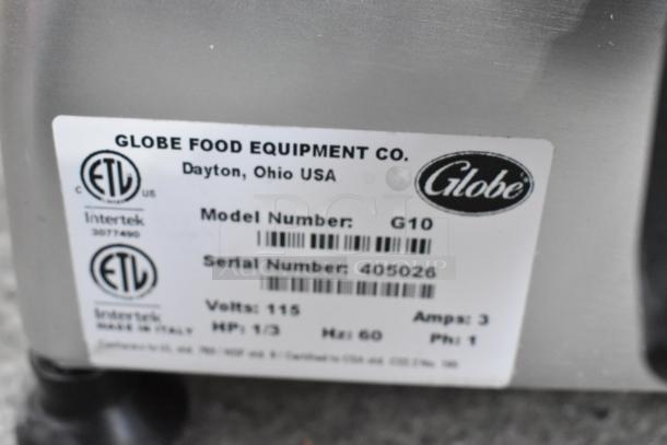 Globe G10 Metal Commercial Meat Slicer with Blade Sharpener, 115V, 1 Phase. Serial 405026, ETL listed, made in Italy.
