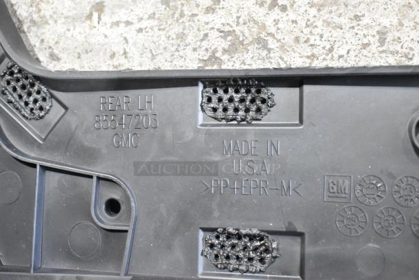 Box of GMC parts in black poly bin, showing label "REAR LH 85547203 GMC," "Made in U.S.A.," and material code ">PP+EPR-M<".