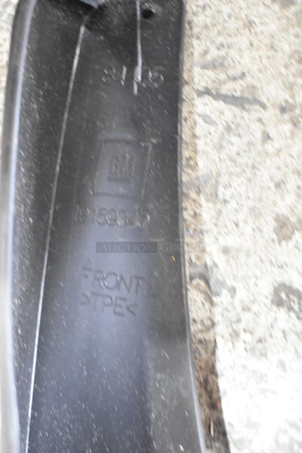 Box containing assorted parts in two black poly bins, marked with GM logo and part number 19132834, indicating front TPE material.