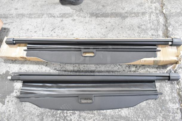 Set of three items including two pull-down screens, in fair condition, with black metal casing and rectangular handles.