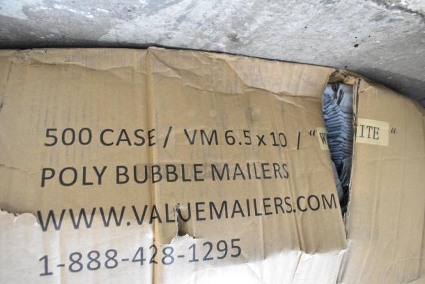 Box of 500 brand new white poly bubble mailers, size 6.5x10 inches, visible label with website and contact info.